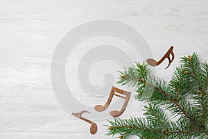 Flat lay composition with Christmas tree branch, music notes and space for text