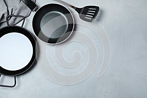 Flat lay composition with clean cookware and space for text
