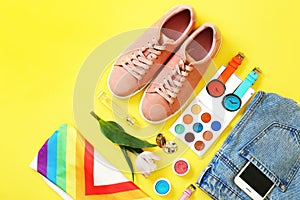 Flat lay composition with clothes and accessories on color background.