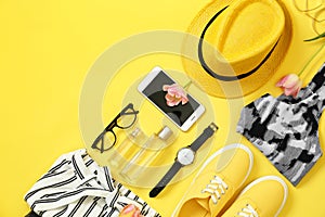Flat lay composition with clothes and accessories on color background, space for text.