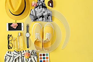 Flat lay composition with clothes and accessories on color background. Trendy spring look