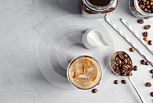 Flat lay composition with cold brew coffee and milk