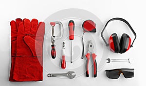 Flat lay composition with construction tools and safety equipment