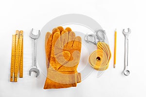Flat lay composition with construction tools and safety equipment