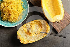Flat lay composition with cooked spaghetti squash and fork