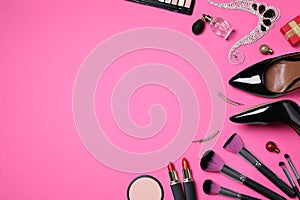 Flat lay composition with cosmetic products and accessories on pink background