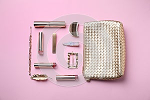 Flat lay composition with cosmetic products and accessories on pink background