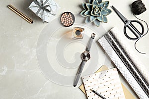 Flat lay composition with cosmetics, decoration elements and space for text on grey background