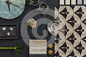 Flat lay composition of creative black architect mood board with samples of building, textile and natural materials and personal. photo