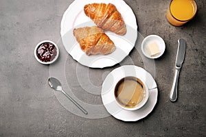 Flat lay composition with cup of coffee and croissants