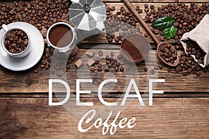 Flat lay composition with decaf coffee beans on wooden table