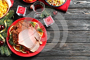 Flat lay composition with delicious ham served on wooden table, space for text. Christmas dinner