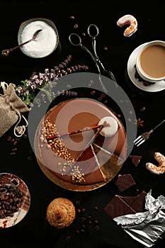 Flat lay composition with different desserts on black background