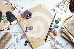 Flat lay composition with different gemstones on wooden background