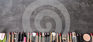 Flat lay composition with different lipsticks on grey background