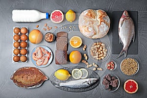 Flat lay composition with different  on dark grey background. Food allergy concept photo