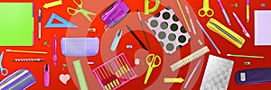 Flat lay composition with different school stationery on red background. Banner design