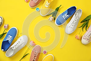 Flat lay composition with different sneakers and accessories on color background, space for text.