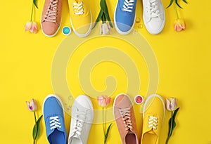 Flat lay composition with different sneakers and accessories on color background, space for text.