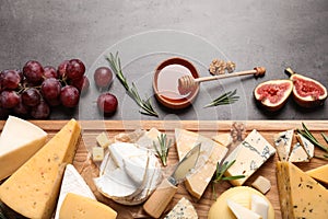 Flat lay composition with different types of  cheese on table
