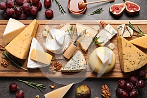 Flat lay composition with different types of delicious cheese on