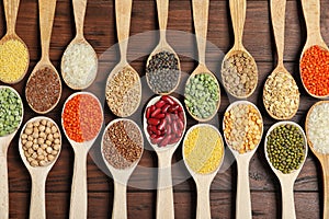 Flat lay composition with different types of legumes and cereals on table. Organic grains