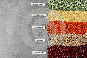 Flat lay composition with different types of legumes and cereals on table. Organic grains