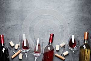 Flat lay composition with different wines on grey background