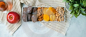 Flat lay composition with dried fruits, wine and nuts. Jewish holiday Tu Bishvat concept. Top view modern background