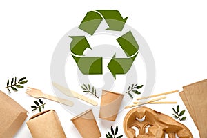 Flat lay composition of eco friendly products and recycling symbol on white background