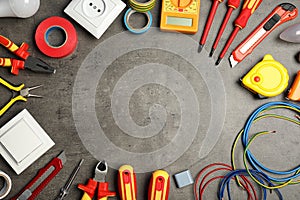 Flat lay composition with electrician`s tools and space for text