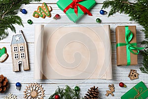 Flat lay composition with empty card and Christmas decorations on white wooden table. Writing letter to Santa