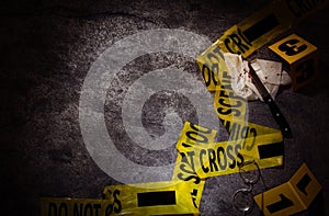 Flat lay composition with evidences and crime scene tape on grey stone background  space for text photo