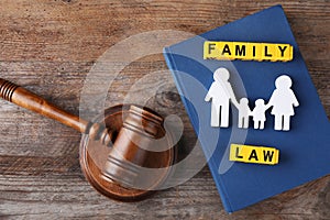 Flat lay composition with figure and gavel on background. Family law concept