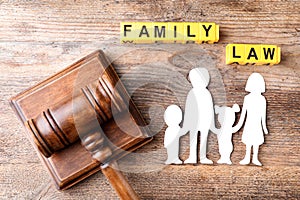 Flat lay composition with figure and gavel on background. Family law concept