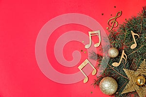 Flat lay composition with fir tree, Christmas decor and wooden music notes on color background. photo