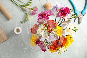 Flat lay composition with freesia bouquet