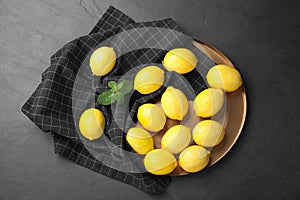 Flat lay composition with fresh ripe lemons on table