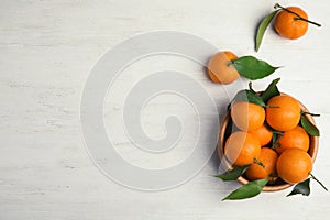 Flat lay composition with fresh ripe tangerines and space for text