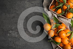 Flat lay composition with fresh ripe tangerines and space for text