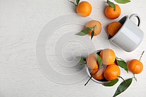 Flat lay composition with fresh ripe tangerines and space for text