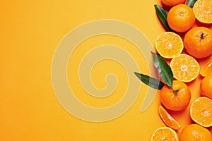 Flat lay composition with fresh ripe tangerines and space for text on background. Citrus fruit