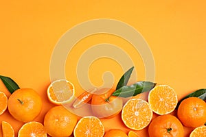 Flat lay composition with fresh ripe tangerines and space for text on background. Citrus fruit