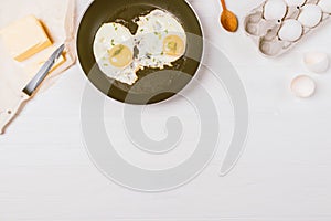 Flat lay composition fried eggs in frying pan