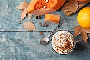 Flat lay composition with glass cup of tasty pumpkin spice latte and space for text