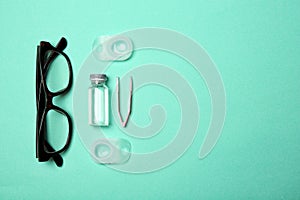 Flat lay composition with glasses, contact lenses