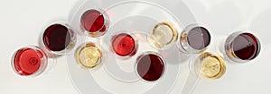 Flat lay composition. Glasses with different wine on white background