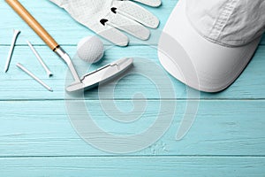 Flat lay composition with golf accessories  on blue wooden background