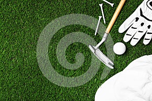 Flat lay composition with golf equipment on artificial grass