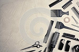 Flat lay composition with hairdresser tools on color background